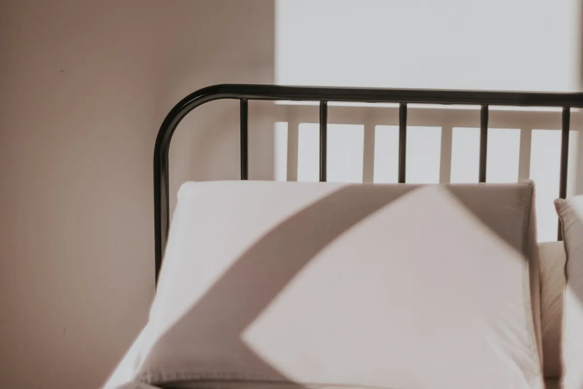 Pillows and bedding in a softly lit bedroom